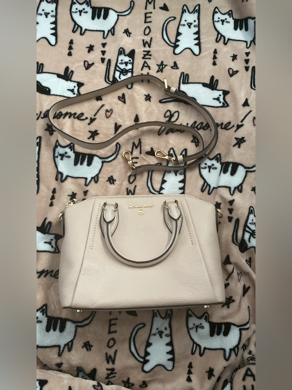 Michael Kors light pink medium crossbody with gold hardware.